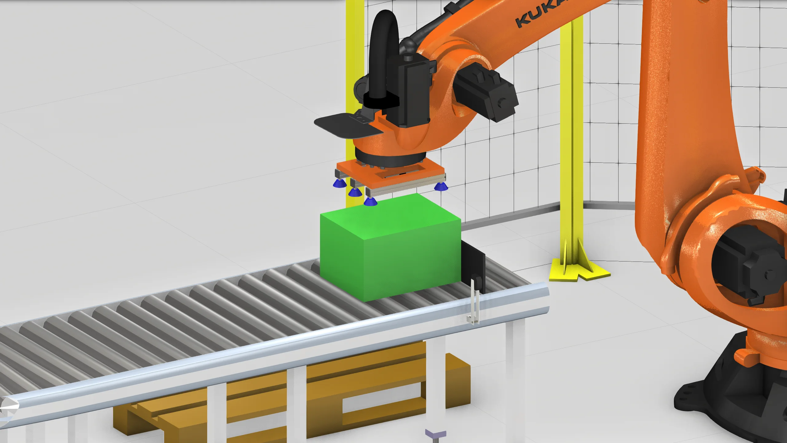 Робот KUKA перемещает коробку в цифровой модели паллетирующей ячейки